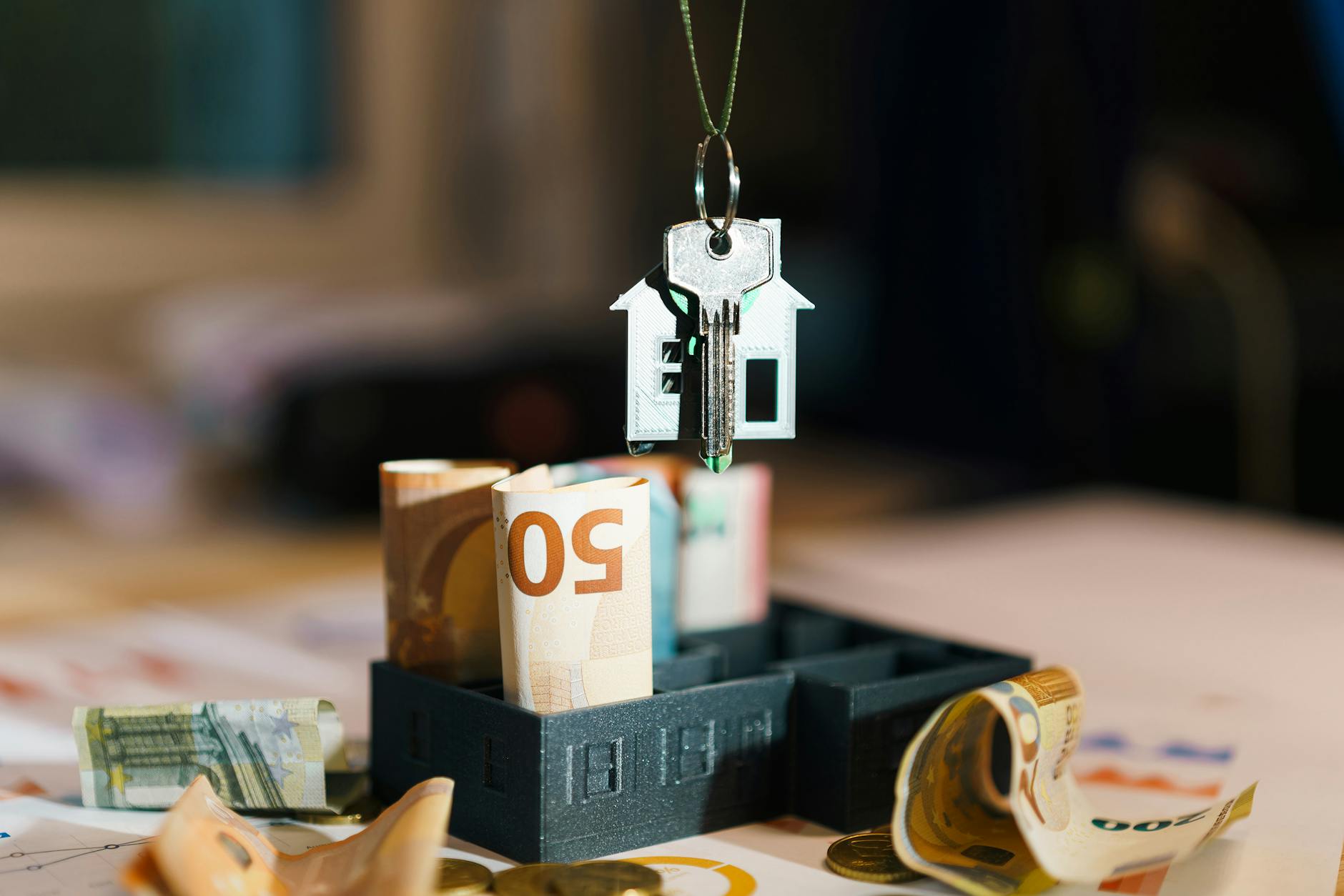 real estate investment with euro banknotes and key